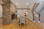 Dining Area with Double-Sided Gas Logs Fireplace